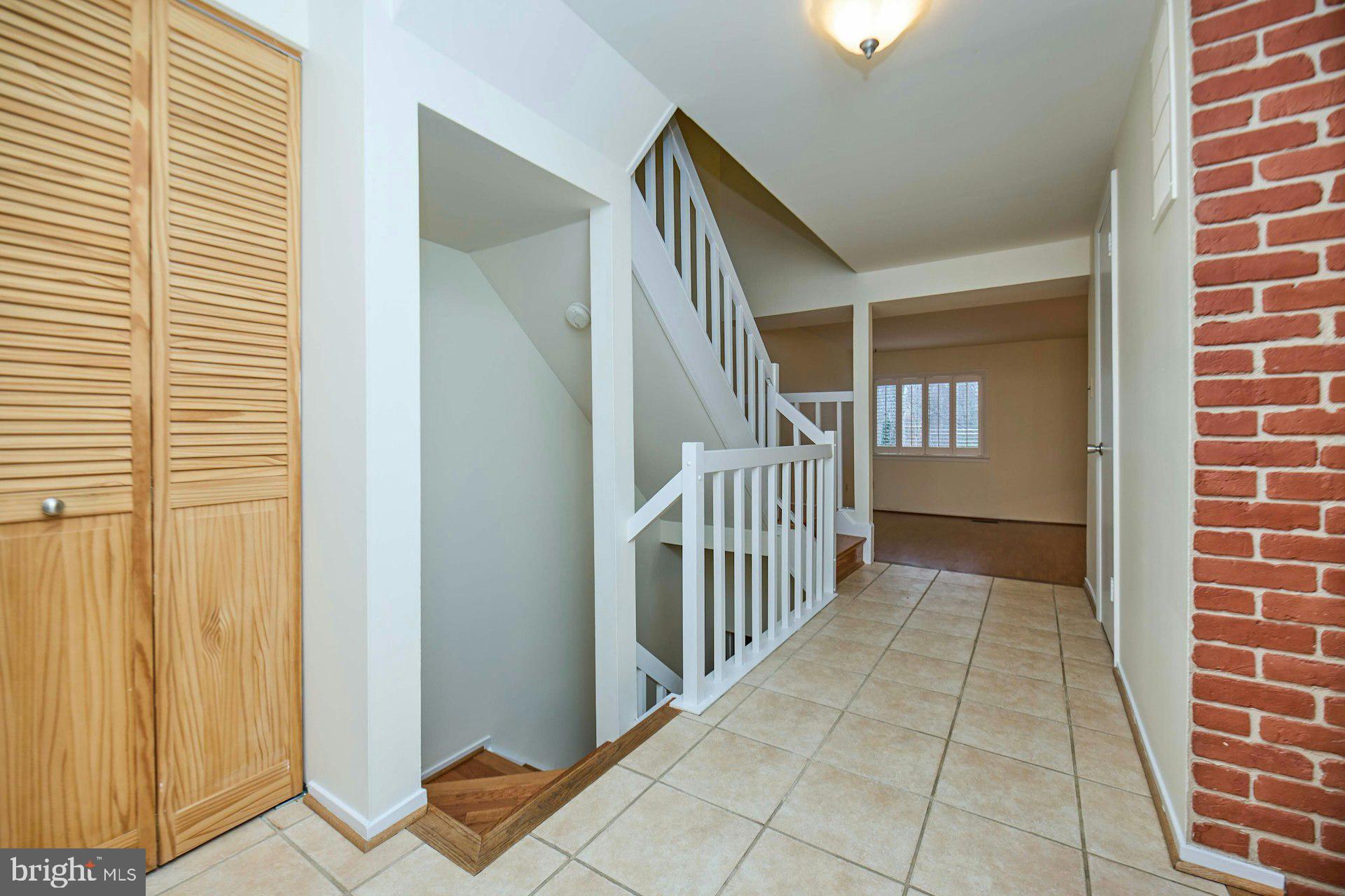 8566 Gwynedd Way Springfield, VA 22153 - Photo 4 of 61 a view of a hallway with windows
