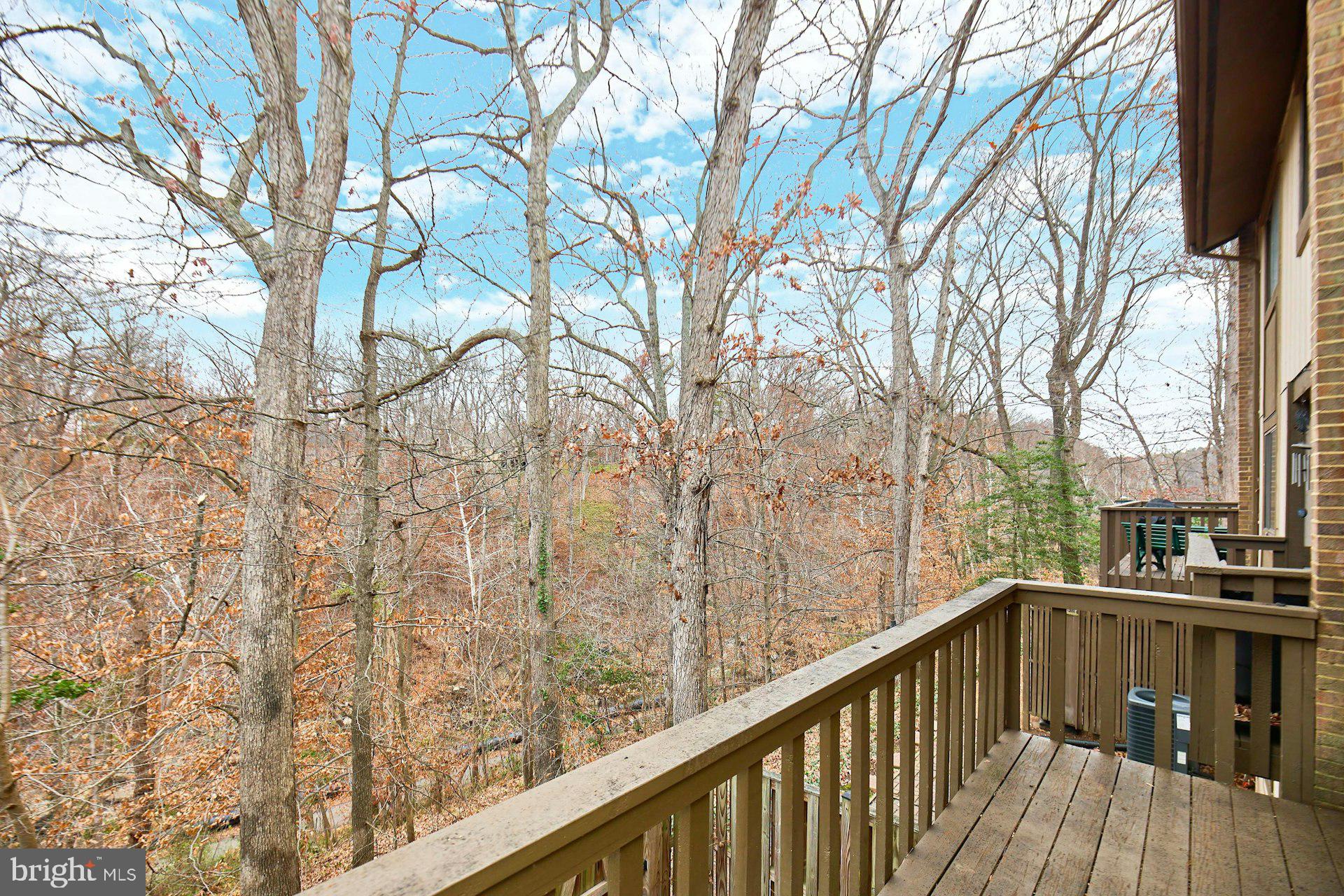 8566 Gwynedd Way Springfield, VA 22153 - Photo 51 of 61 a view of a balcony with wooden fence