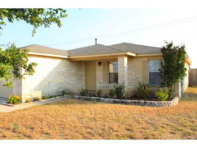 100 Mason Reed Cove Kyle, TX 78640 - Photo 1 of 1 a front view of a house with a yard