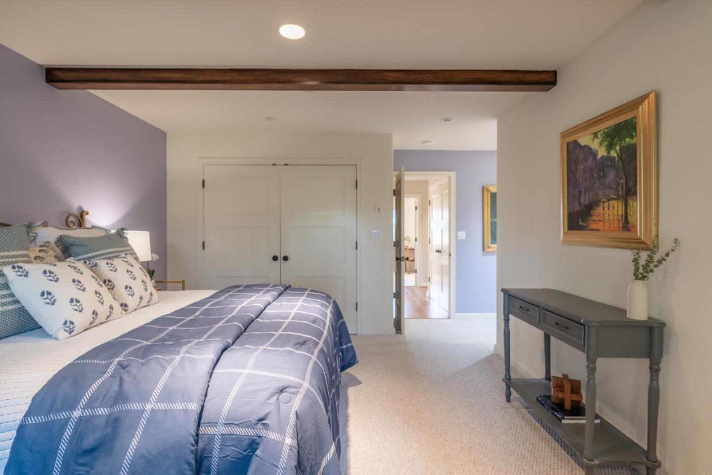 142 Del Mesa Carmel Carmel, CA 93923 - Photo 18 of 39 a bedroom with a bed and a chandelier