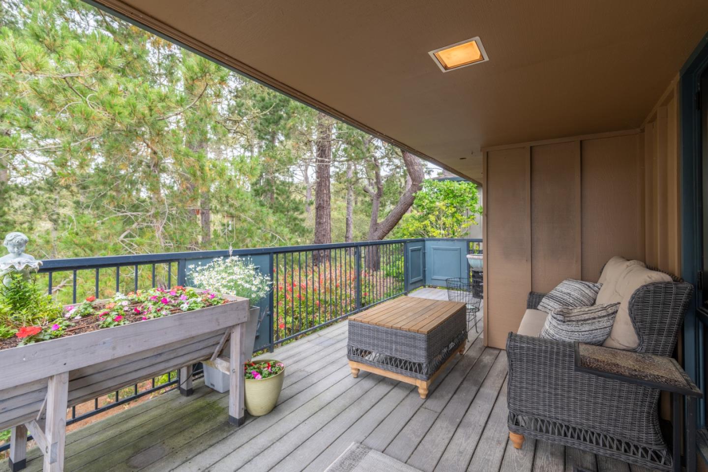 142 Del Mesa Carmel Carmel, CA 93923 - Photo 23 of 39 a balcony with wooden floor table and chairs