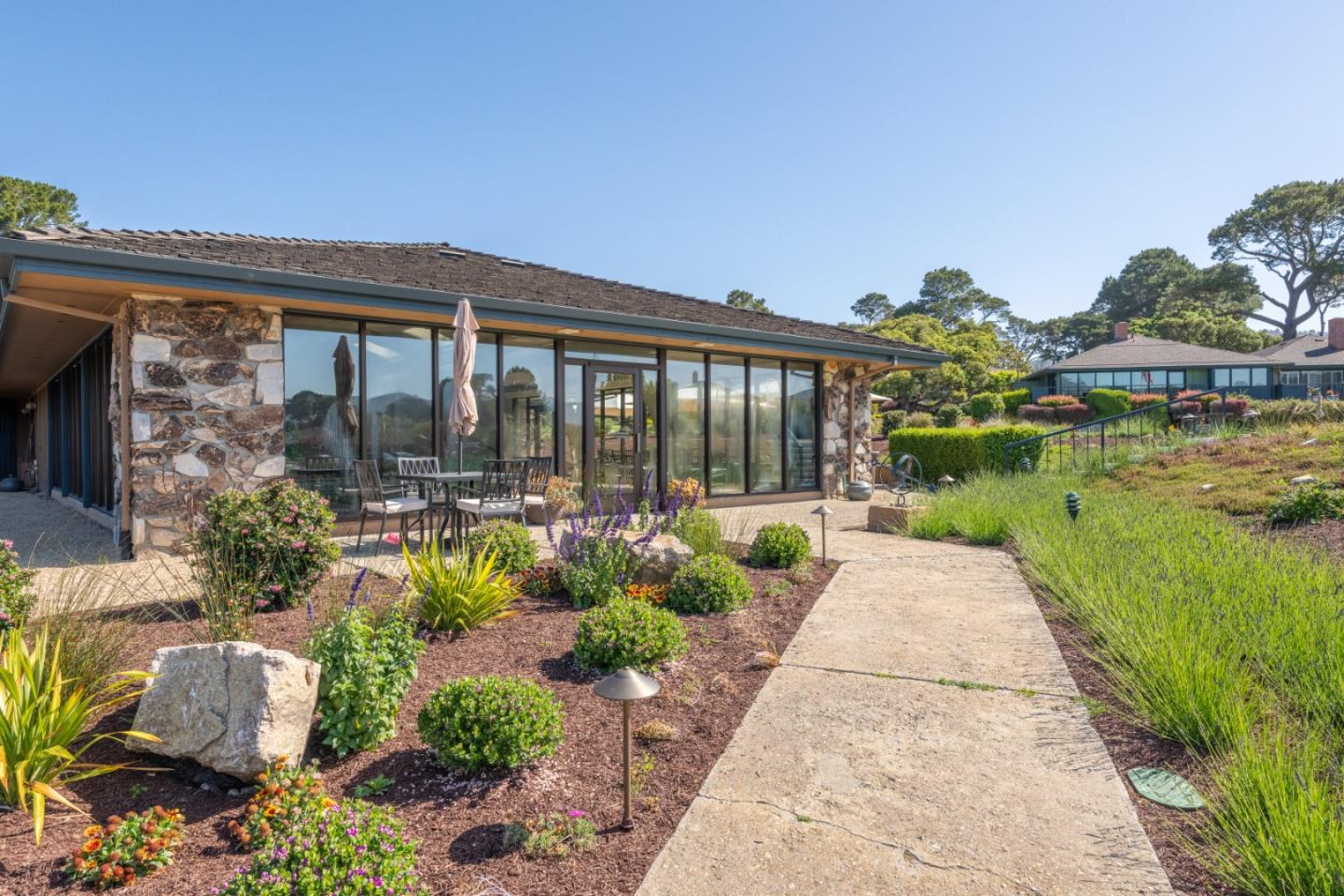 142 Del Mesa Carmel Carmel, CA 93923 - Photo 34 of 39 a house with garden in front of it