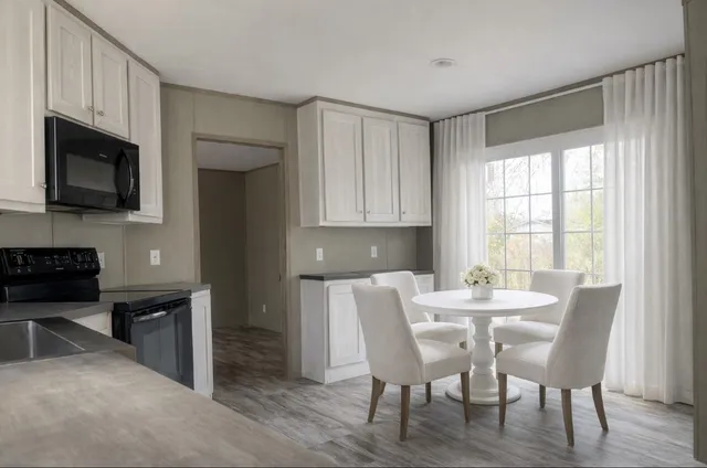 a view of a dining room with furniture and a fireplace
