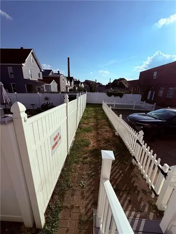 a view of a house with backyard and porch