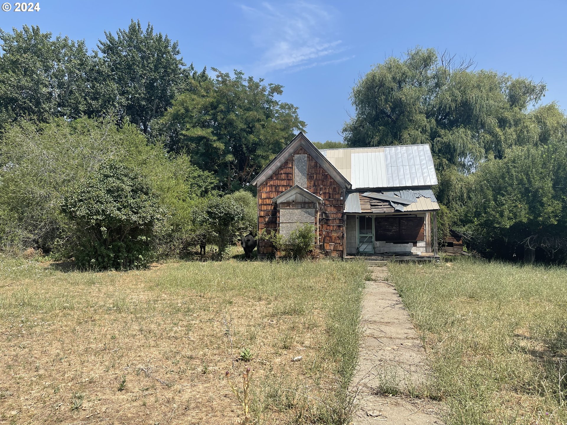 Cornucopia Highway Halfway, OR 97834 - Photo 1 of 13 a front view of a house with a yard and garage