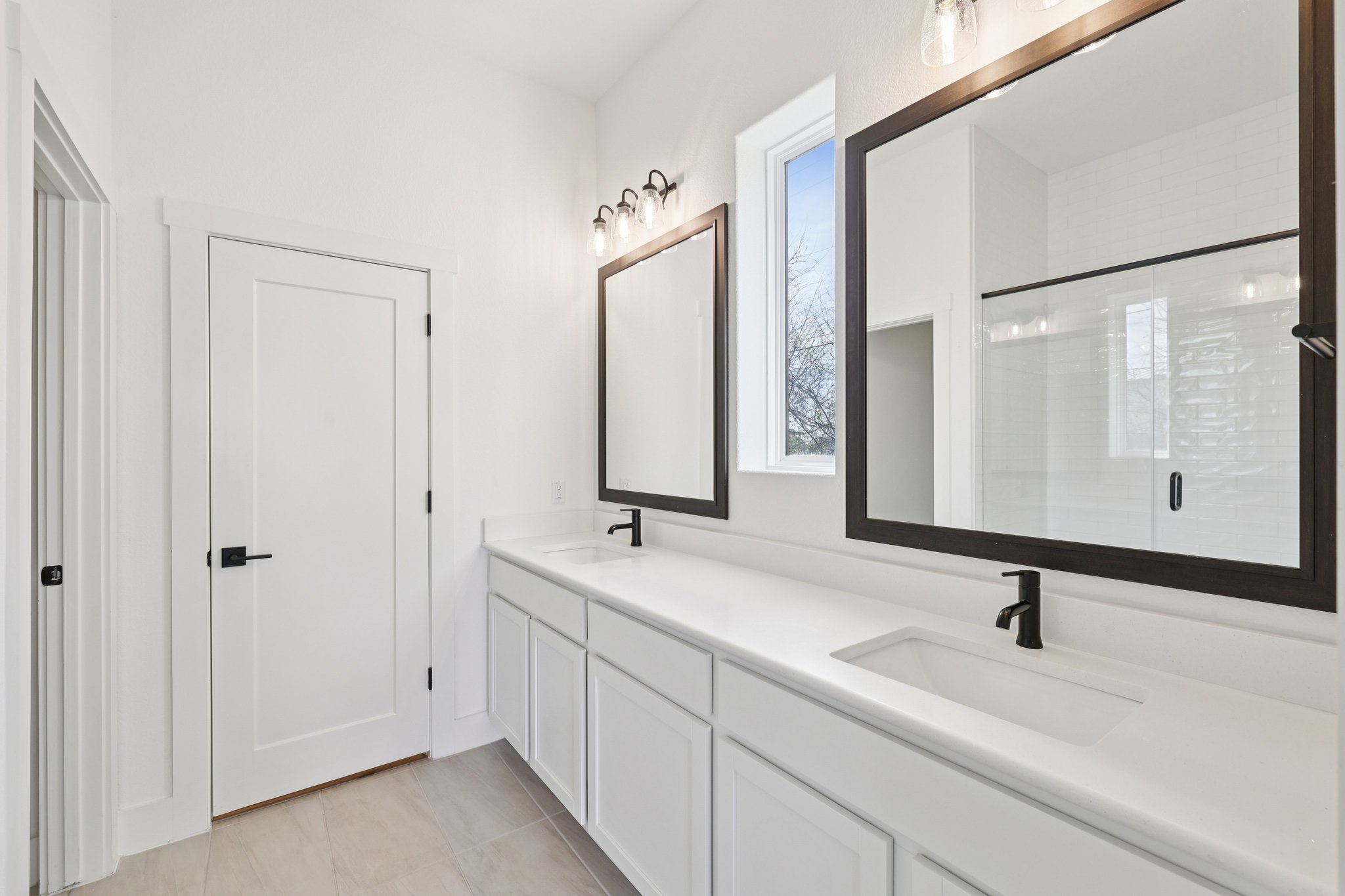8760 Wellspring Loop Hutto, TX 78634 - Photo 23 of 37 Bathroom featuring double vanity and a stall shower