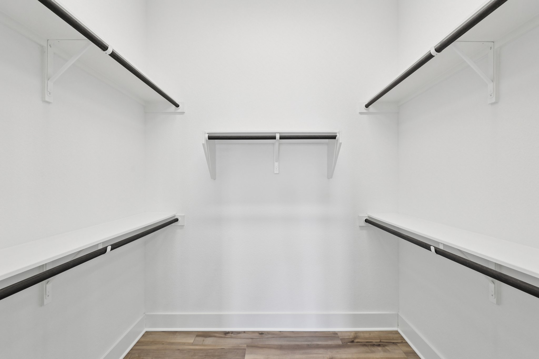 8760 Wellspring Loop Hutto, TX 78634 - Photo 25 of 37 Walk in closet with light wood-style floors