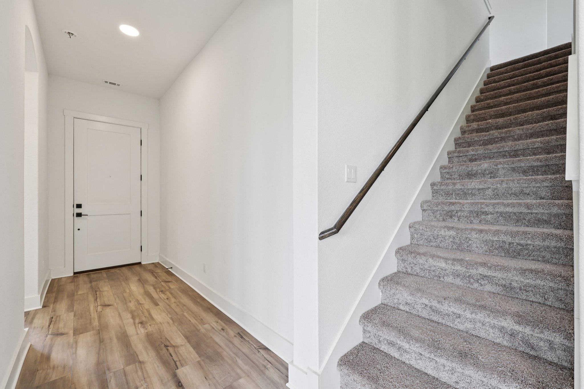 8760 Wellspring Loop Hutto, TX 78634 - Photo 7 of 37 Stairs featuring wood finished floors and recessed lighting