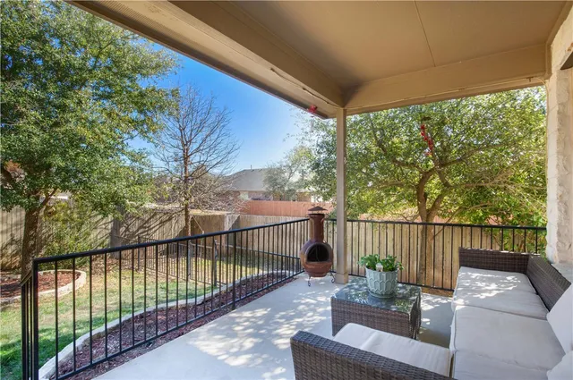 a view of a backyard with tree
