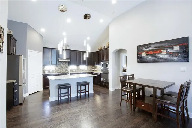 a kitchen with a table and chairs in it