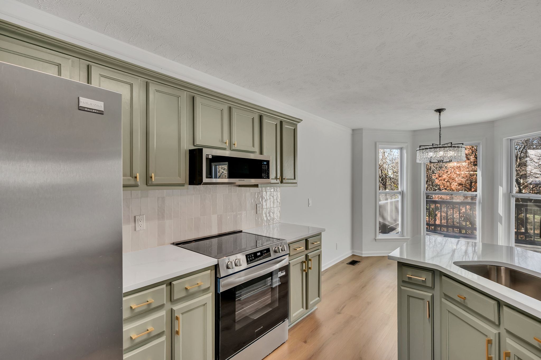 253 Burgandy Hill Road Nashville, TN 37211 - Photo 13 of 28 a kitchen with stainless steel appliances a sink stove and microwave