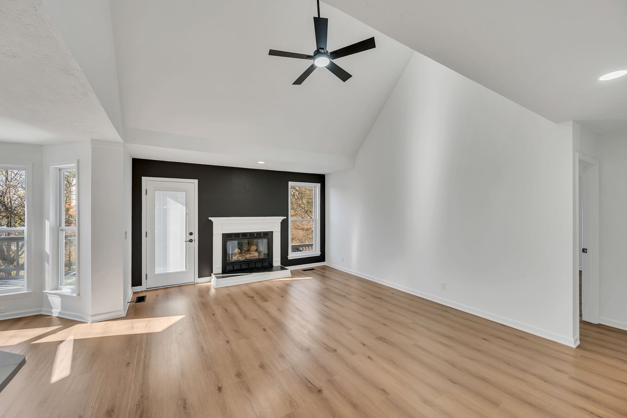 253 Burgandy Hill Road Nashville, TN 37211 - Photo 8 of 28 wooden floor fireplace and windows in an empty room