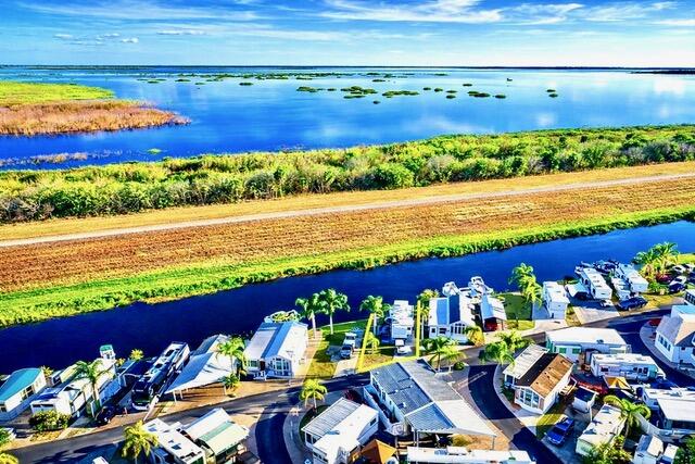 7950 West W Highway, Unit 75 Okeechobee, FL 34974 - Photo 11 of 11 a view of a swimming pool with an outdoor space
