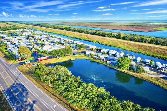 7950 West W Highway, Unit 75 Okeechobee, FL 34974 - Photo 9 of 11 a view of a city and an ocean view