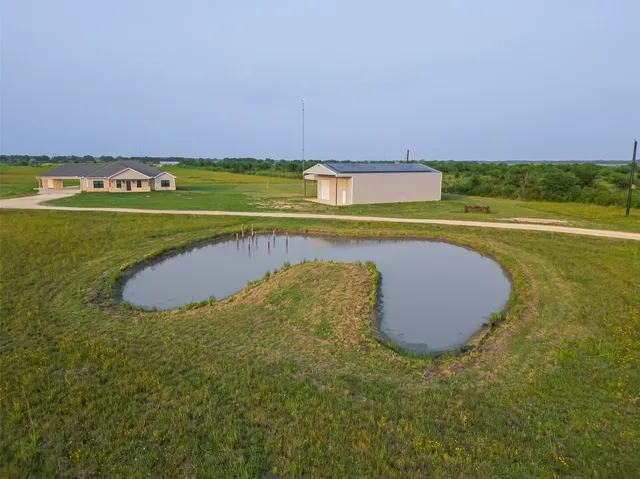 a view of a swimming pool and an outdoor space