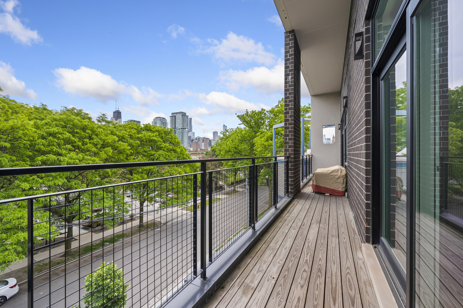 1310 North Cleveland Avenue, Unit 3 Chicago, IL 60610 - Photo 13 of 22 a view of a balcony with wooden floor
