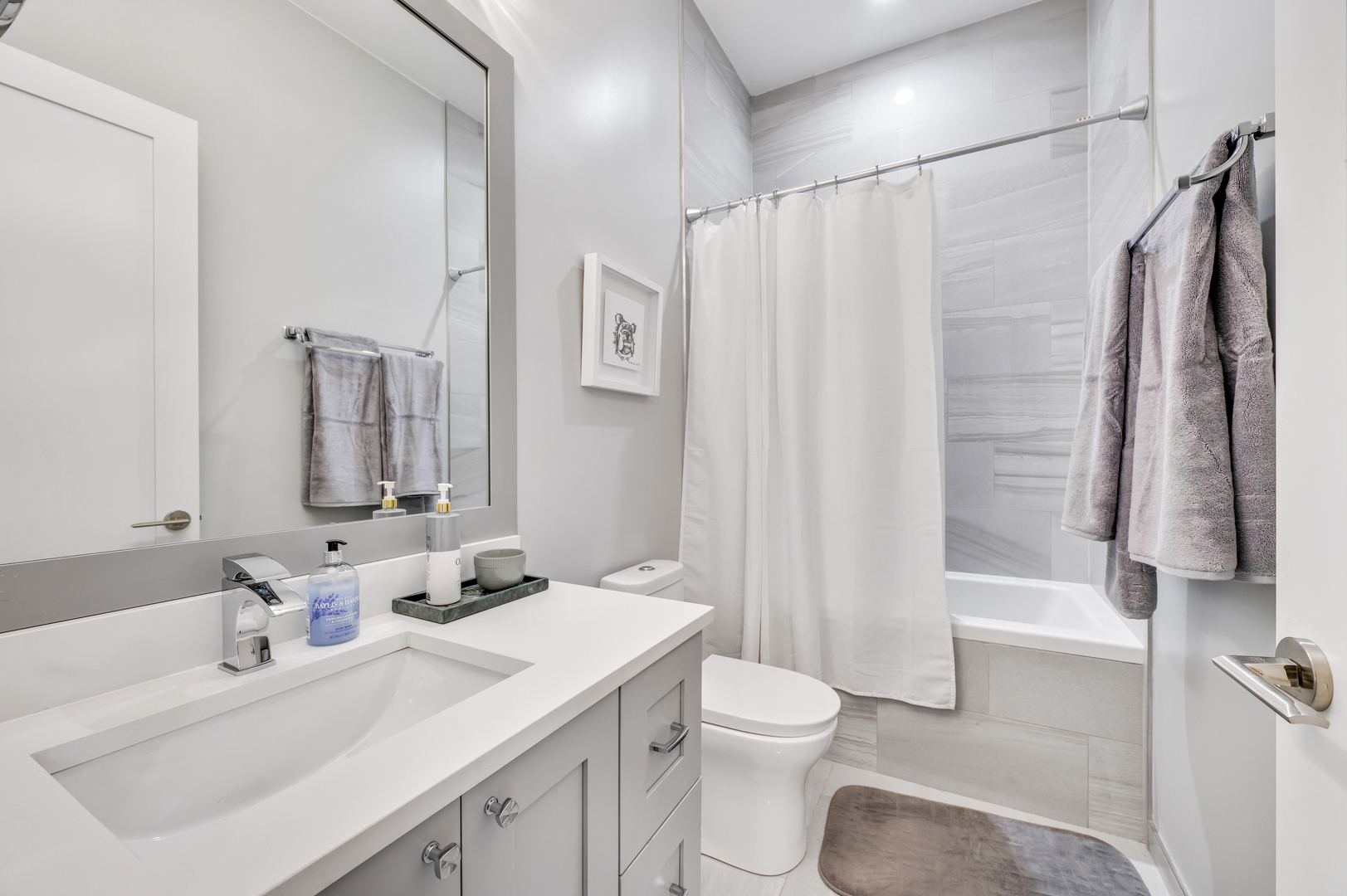 1310 North Cleveland Avenue, Unit 3 Chicago, IL 60610 - Photo 17 of 22 a bathroom with a sink toilet and shower