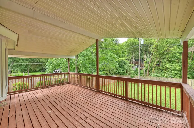 a view of a porch with wooden fence