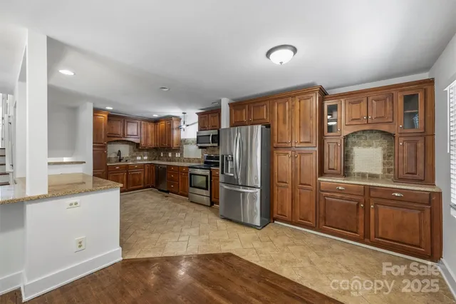 a kitchen with refrigerator cabinets and furniture