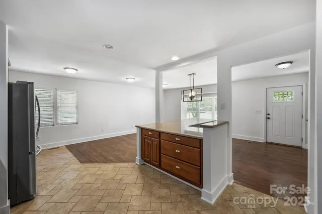 a view of kitchen with wooden floor