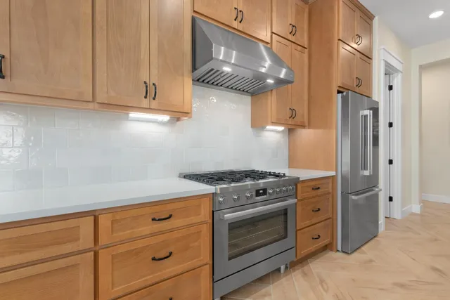 a close up of a stove top oven sitting inside of a kitchen