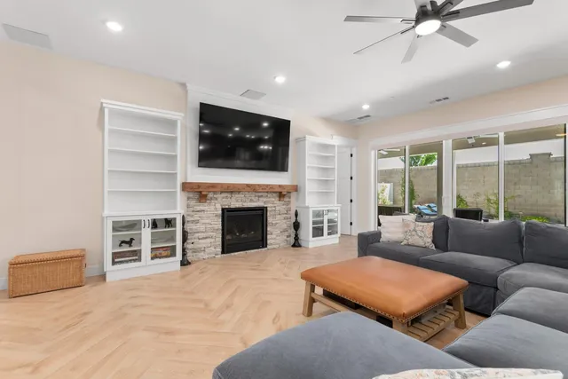 a bedroom with furniture and a flat screen tv