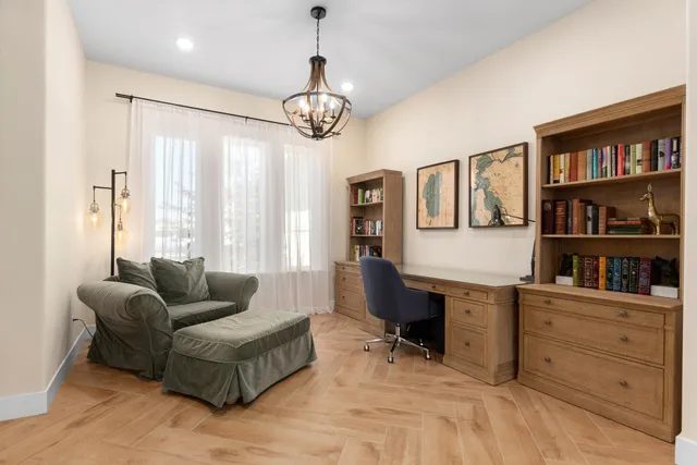 a living room with furniture cabinets and window
