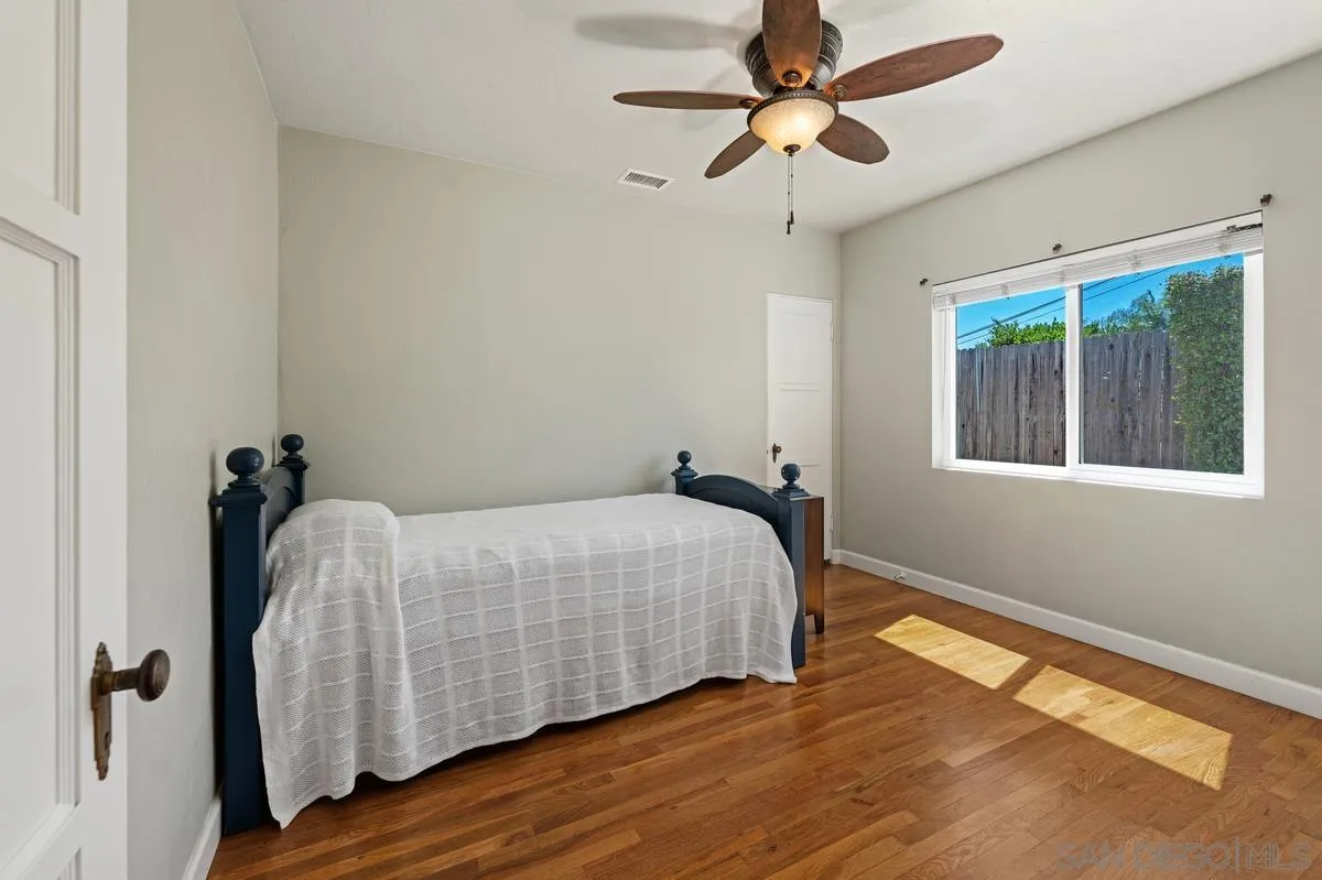 4744 Resmar Road La Mesa, CA 91941 - Photo 13 of 58 a bedroom with a bed and a window