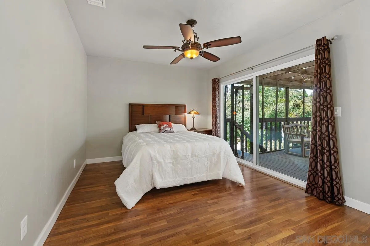 4744 Resmar Road La Mesa, CA 91941 - Photo 15 of 58 a bed room with a bed and a window