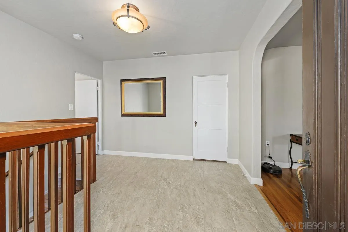 4744 Resmar Road La Mesa, CA 91941 - Photo 4 of 58 a view of a room with wooden floor and a bathroom