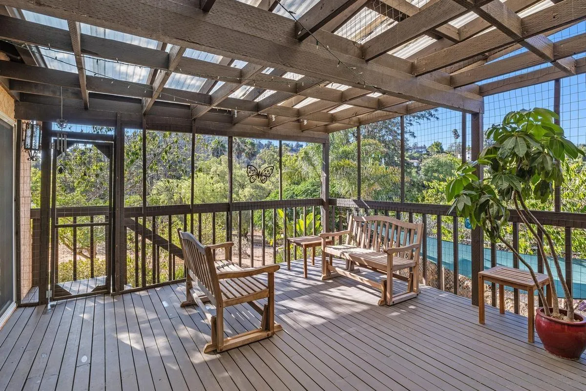 4744 Resmar Road La Mesa, CA 91941 - Photo 7 of 58 a view of a chairs and table in patio with wooden floor