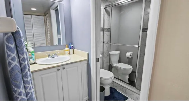 a bedroom with a bed and a closet