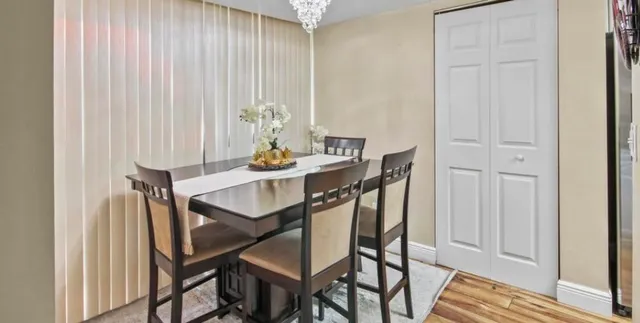 a view of a dining room with furniture and window