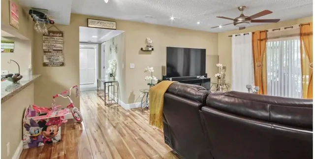 a bedroom with a bed and a dresser in it