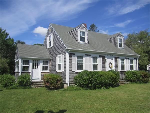 1779 Main Road, Unit LOT 2 Westport, MA 02790 - Photo 1 of 7 a front view of a house with a garden
