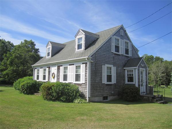 1779 Main Road, Unit LOT 2 Westport, MA 02790 - Photo 2 of 7 a front view of a house with a yard