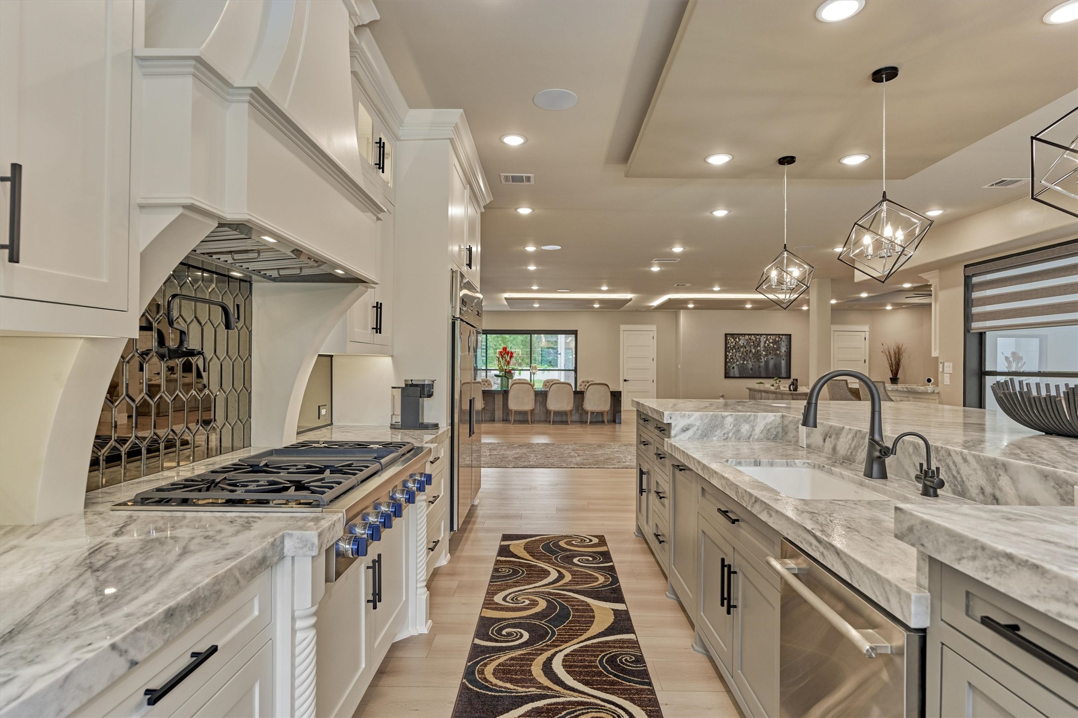 1907 Woerner Road Houston, TX 77090 - Photo 14 of 50 Thermador gas cooktop, pot filler and exceptional millwork makes this a dream kitchen. Full commercial grade built-in refrigerator and freezer.