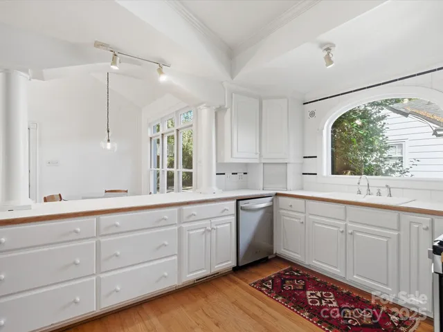 a kitchen with stainless steel appliances a refrigerator and a stove top oven