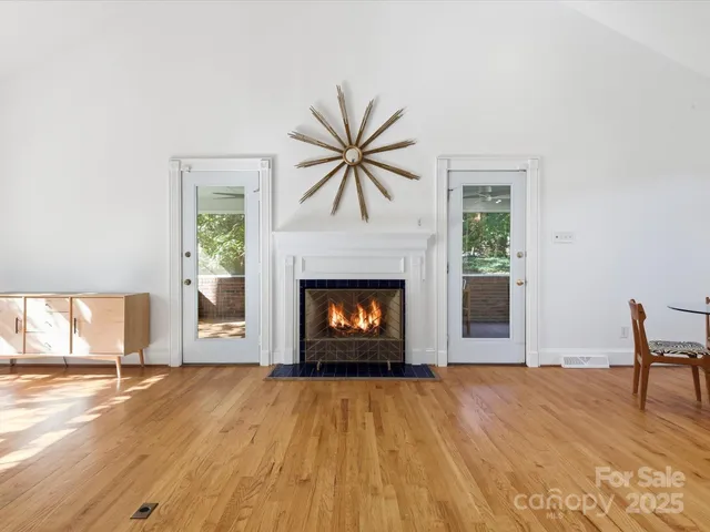 a living room with a fireplace and a fireplace