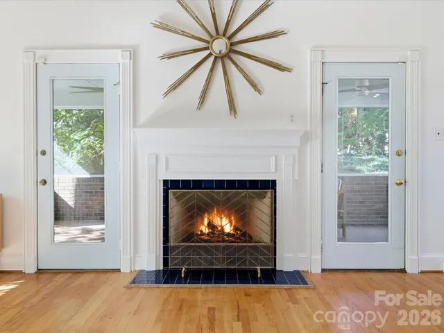 a living room with a fireplace and a fireplace
