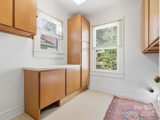 a view of entryway with wooden floor and door