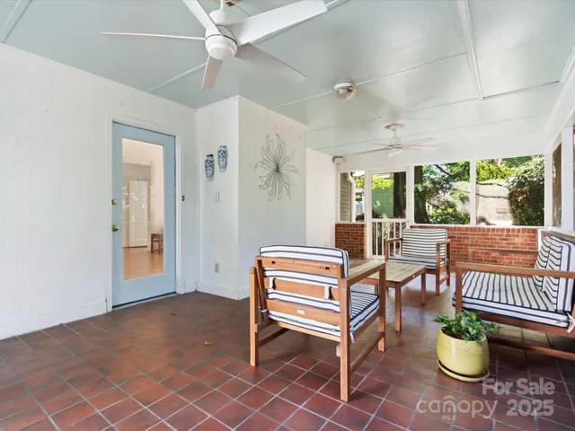 an aerial view of multiple houses with a yard