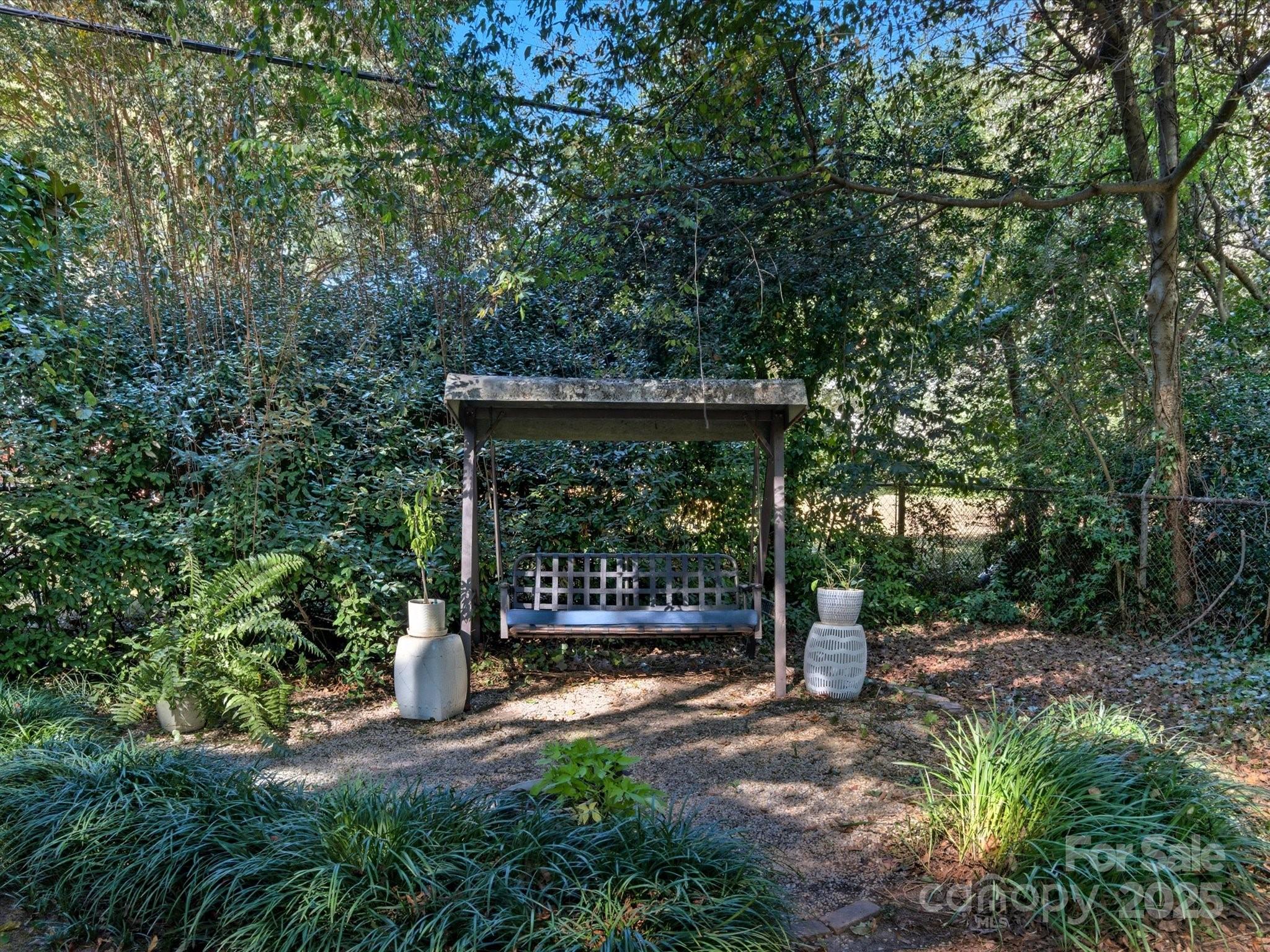 759 Myrtle Drive Rock Hill, SC 29730 - Photo 42 of 47 a view of a patio with table and chairs under an umbrella