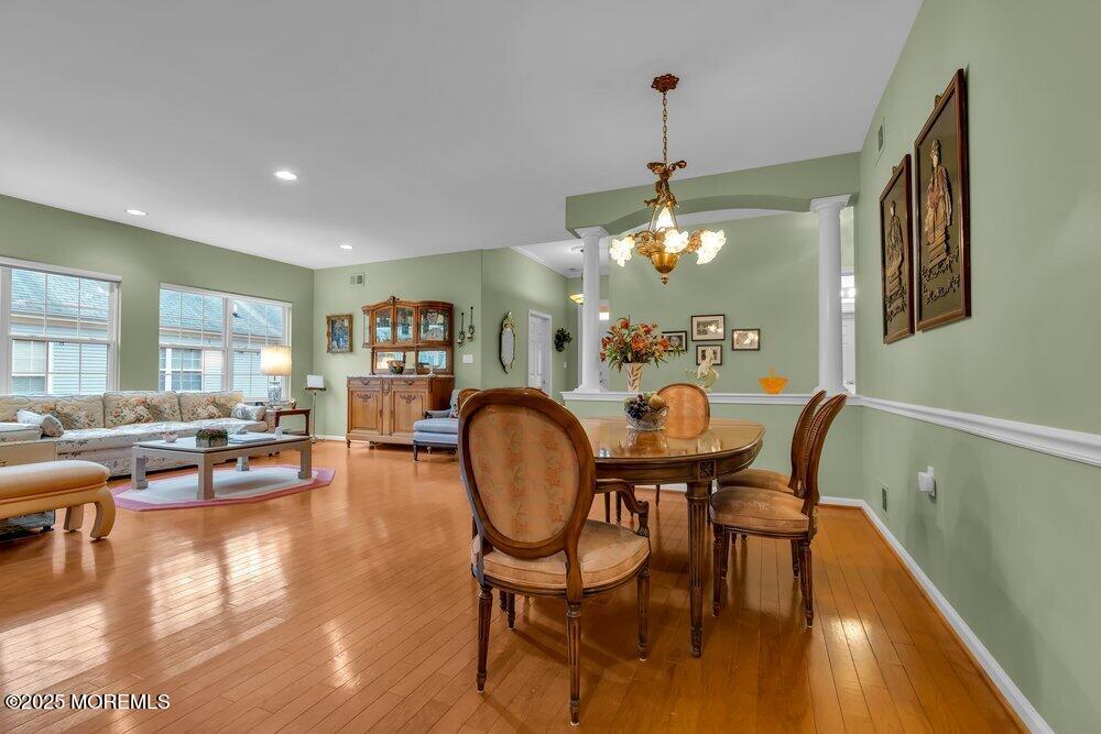54 Drayton Road Manchester Township, NJ 08759 - Photo 2 of 93 a dining room with furniture a chandelier and wooden floor