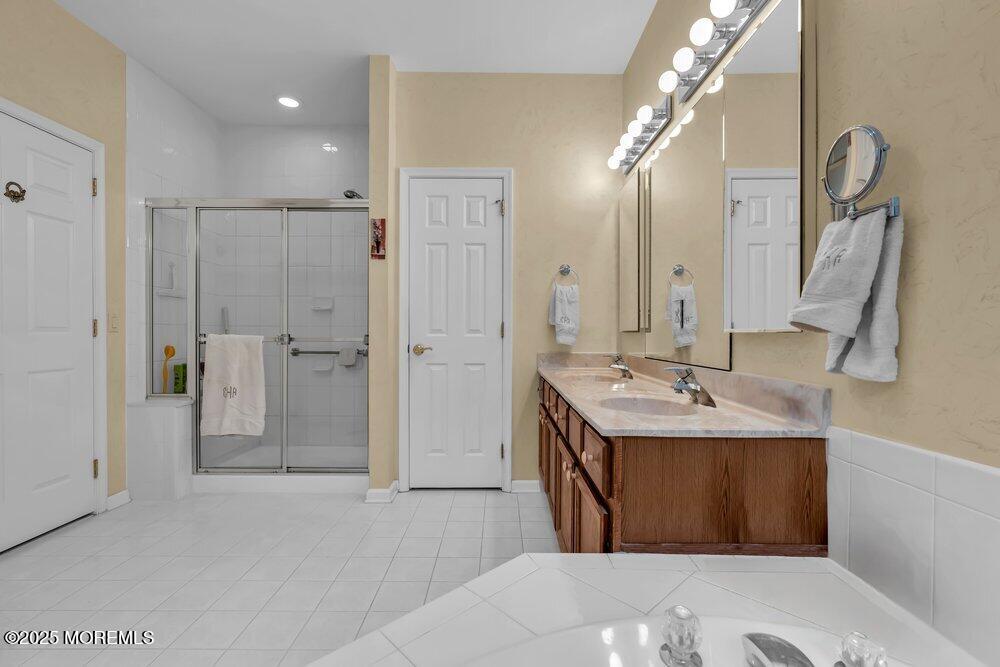 54 Drayton Road Manchester Township, NJ 08759 - Photo 22 of 93 a bathroom with a double vanity sink mirror and shower