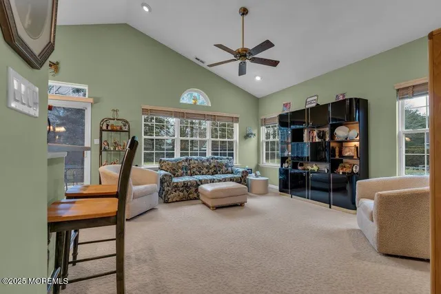 a bathroom with a double vanity sink mirror and shower