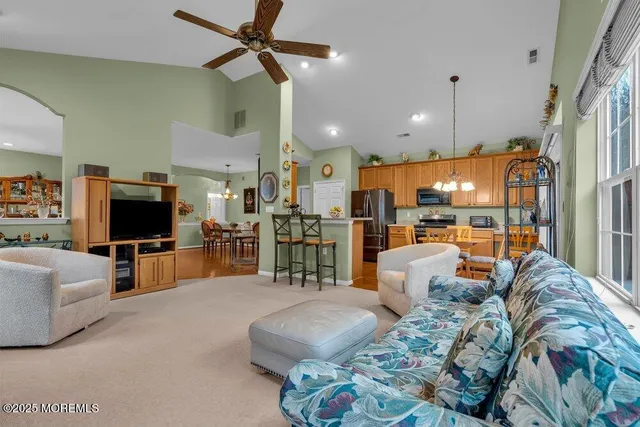 a front view of a house with yard and green space