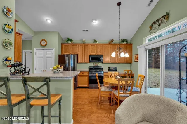a front view of a house with a yard patio and fire pit