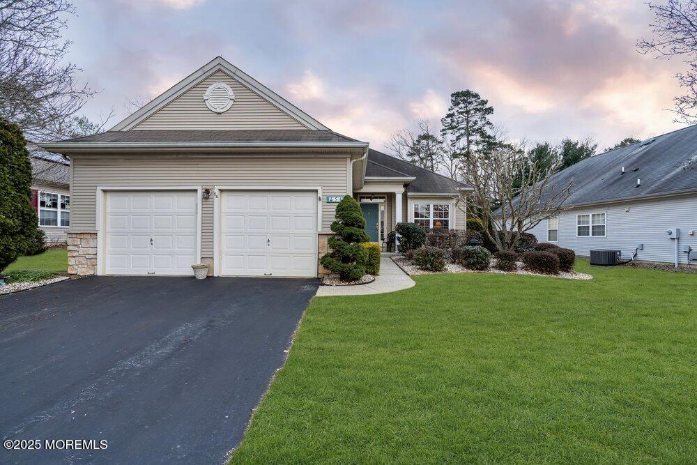 54 Drayton Road Manchester Township, NJ 08759 - Photo 42 of 93 a front view of a house with a garden and plants