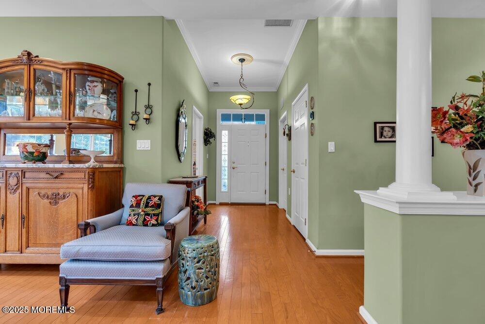 54 Drayton Road Manchester Township, NJ 08759 - Photo 45 of 93 a living room with furniture and a chandelier